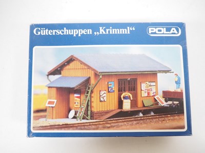 Lot 27 - A group of HO gauge kitbuilt plastic buildings...