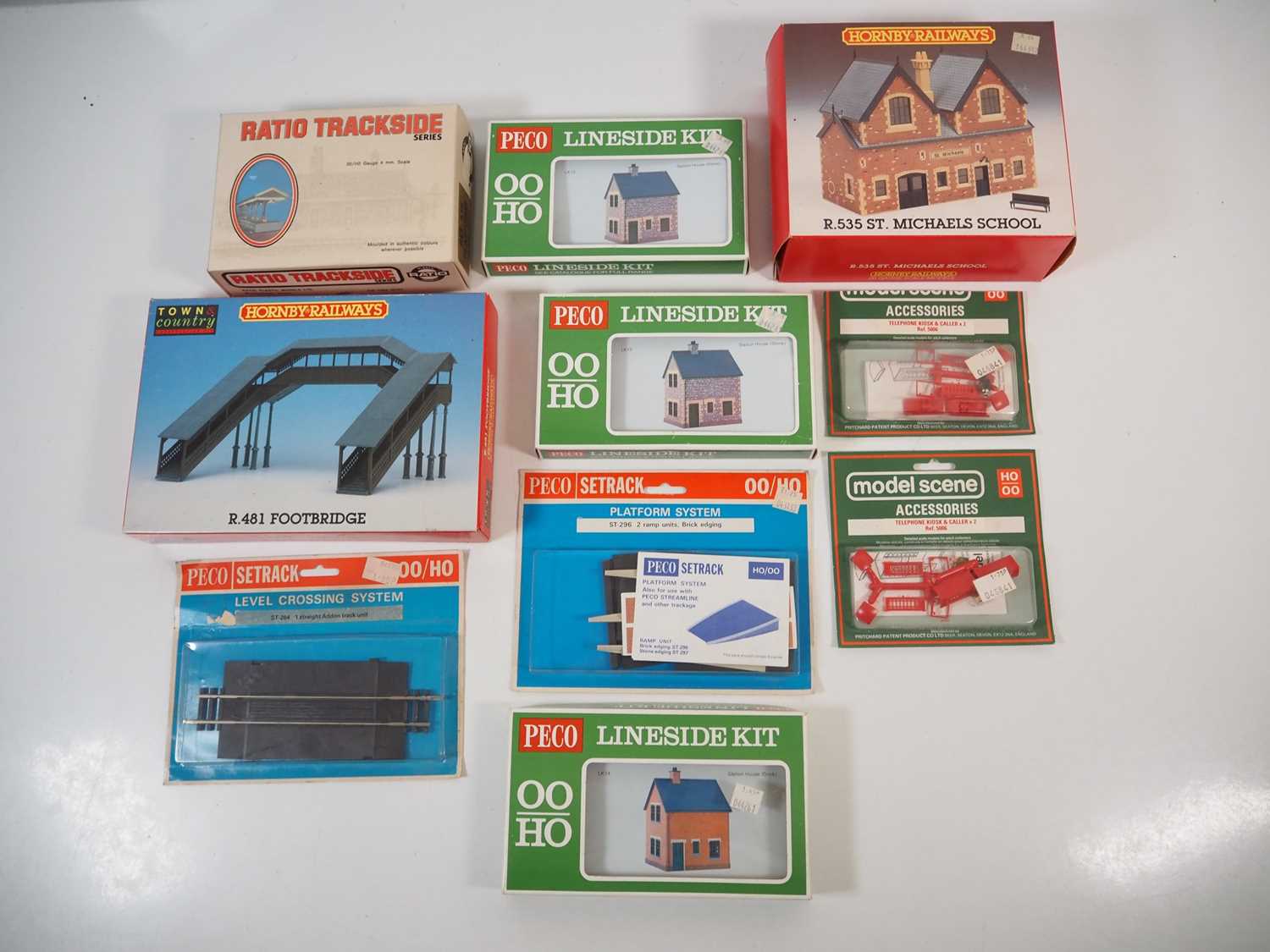 Lot 34 - A group of OO gauge plastic building kits and...
