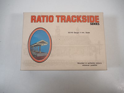 Lot 34 - A group of OO gauge plastic building kits and...