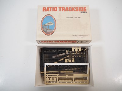 Lot 34 - A group of OO gauge plastic building kits and...