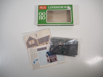 Lot 34 - A group of OO gauge plastic building kits and...