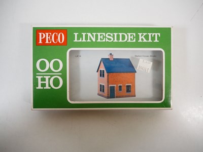 Lot 34 - A group of OO gauge plastic building kits and...