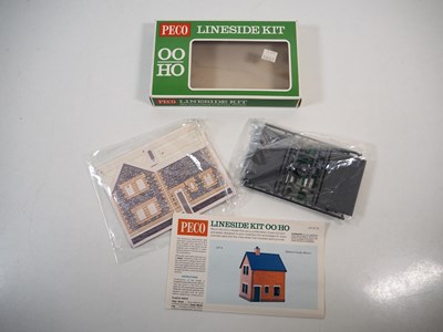 Lot 34 - A group of OO gauge plastic building kits and...