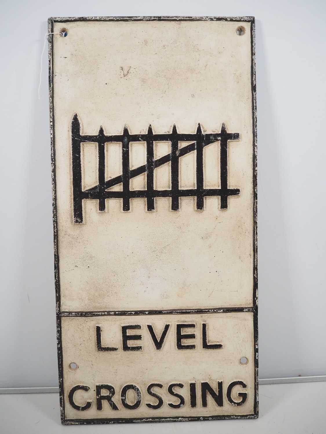 Lot 258 - A cast iron vintage road sign 'Level Crossing',...