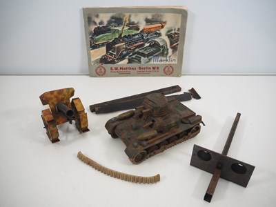 Lot 301 - A group of pre-war tinplate toys comprising a...