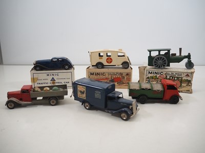 Lot 306 - A group of TRIANG MINIC clockwork vehicles,...