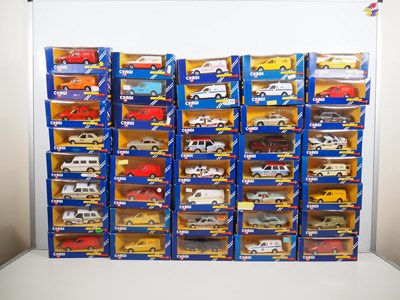 Lot 343 - A group of CORGI diecast cars and vans in blue...