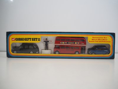 Lot 522 - A CORGI gift set #11 comprising a London taxi,...