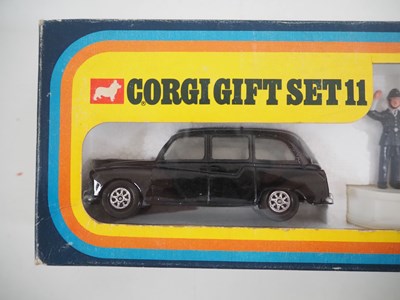 Lot 522 - A CORGI gift set #11 comprising a London taxi,...