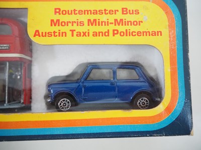 Lot 522 - A CORGI gift set #11 comprising a London taxi,...