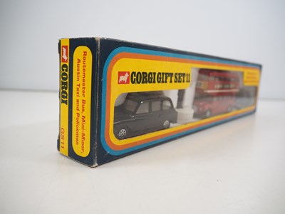 Lot 522 - A CORGI gift set #11 comprising a London taxi,...