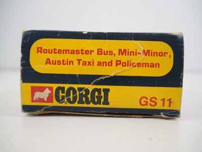 Lot 522 - A CORGI gift set #11 comprising a London taxi,...