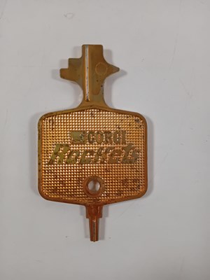Lot 510 - A CORGI Rockets shop display key in gold...
