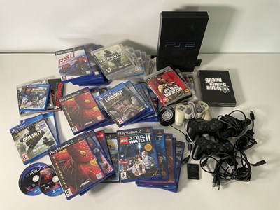 Lot 637 - A SONY PLAYSTATION 2 game console, controllers...