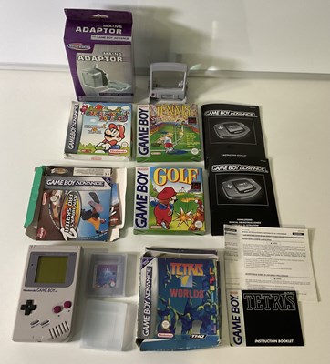 Lot 635 - A Nintendo Game Boy and magnifying screen...