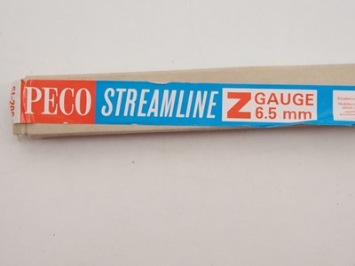 Lot 9 - A group of N gauge track and accessories by...