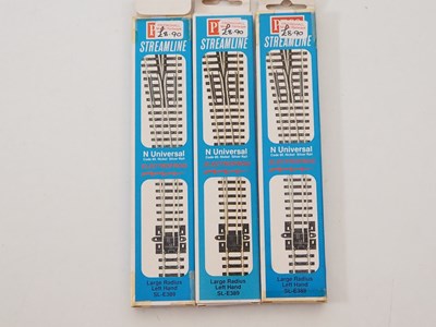Lot 9 - A group of N gauge track and accessories by...