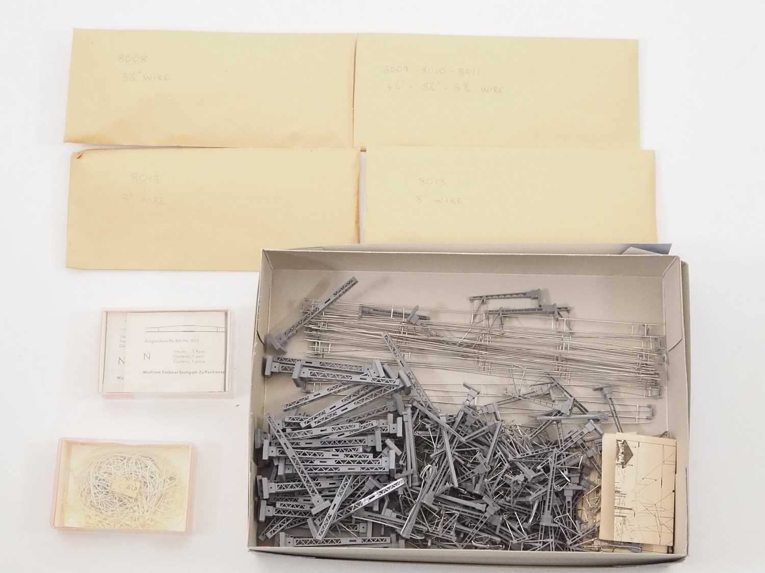 Lot 27 - A large quantity of N gauge catenary masts,...