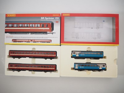 Lot 325 - A pair of HORNBY OO gauge 2-car DMUs...