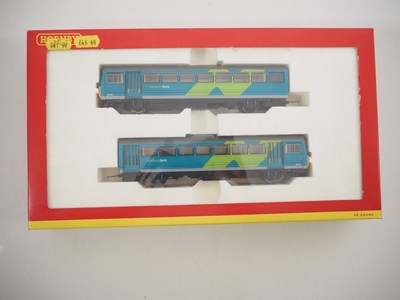 Lot 326 - A pair of HORNBY OO gauge class 142 Pacer DMUs...
