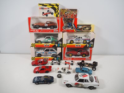 Lot 554 - A group of boxed and unboxed diecast cars by...
