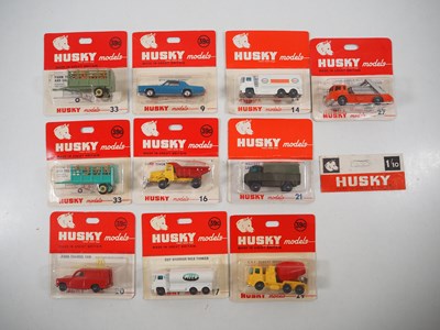 Lot 718 - HUSKY - A group of diecast vehicles sealed on...