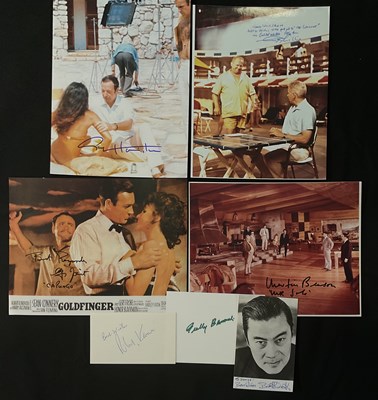 Lot 572 - GOLDFINGER - A group of autographs on mixed...