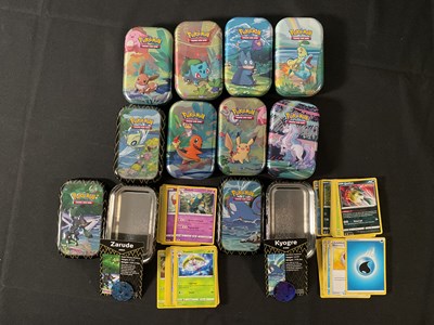 Lot 525 - A collection of 10 tins of Pokémon cards from...
