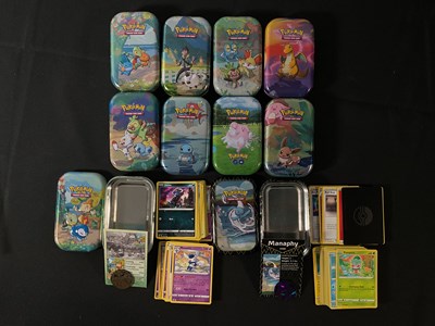 Lot 524 - A collection of 10 tins of Pokémon cards from...