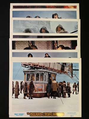 Lot 318 - ISLAND AT THE TOP OF THE WORLD (1974) A group...