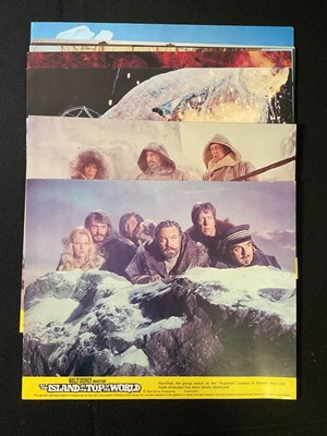 Lot 318 - ISLAND AT THE TOP OF THE WORLD (1974) A group...