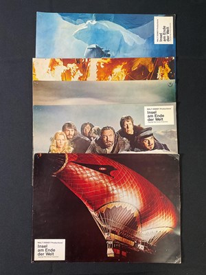 Lot 318 - ISLAND AT THE TOP OF THE WORLD (1974) A group...