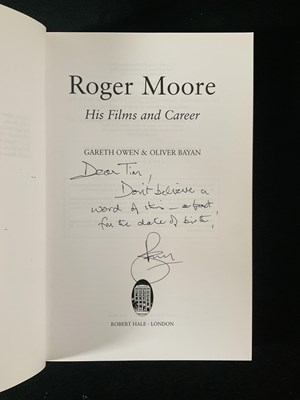 Lot 607 - ROGER MOORE - A signed paperback book ‘His...