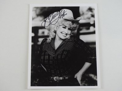 Lot 136 - A signed black/white 10x8 photograph of DOLLY...