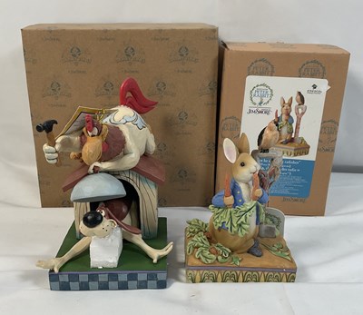 Lot 407 - A pair of Jim Shore designed cartoon figurines...