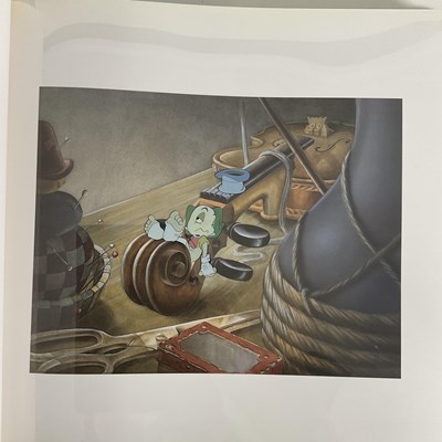 Lot 401 - A pair of Walt Disney art books by PIERRE...