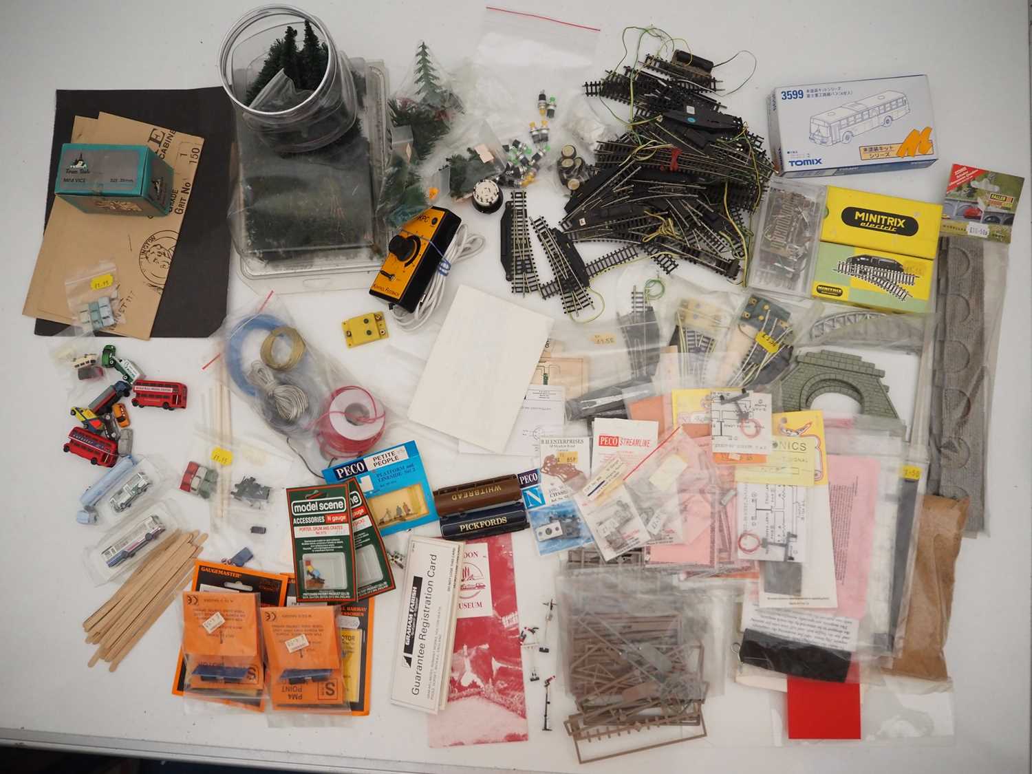 Lot 8 - A large quantity of N gauge track, controllers,...