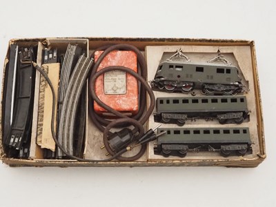 Lot 36 - A vintage 3-rail HO gauge train set with...