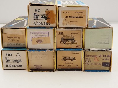 Lot 37 - A group of boxed PIKO HO gauge wagons and...