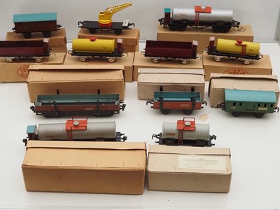 Lot 210 - A group of boxed tinplate O gauge wagons by...