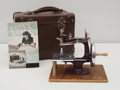 Lot 254 - An ESSEX children's miniature sewing machine,...