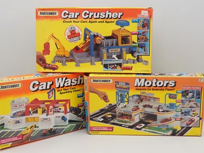 Lot 497 - MATCHBOX - Playsets 'Motors' , 'Car Crusher'...