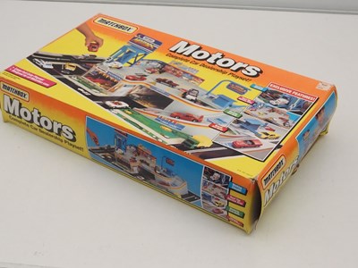 Lot 497 - MATCHBOX - Playsets 'Motors' , 'Car Crusher'...