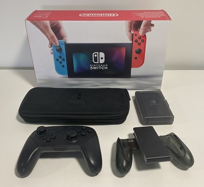 Lot 544 - A boxed NINTENDO SWITCH console with 2 pairs...