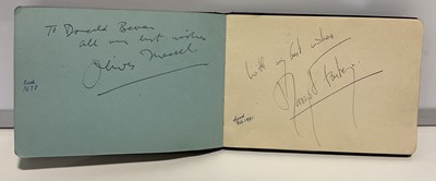 Lot 552 - An autograph book containing a mix of...