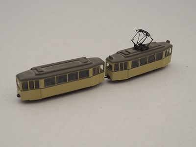 Lot 26 - A KATO N gauge 4 wheel tram car together with...