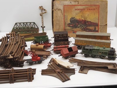 Lot 148 - A large quantity of HORNBY O gauge trains and...