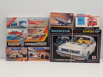 Lot 190 - A group of unbuilt plastic kits of cars,...