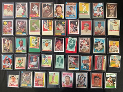 Lot 504 - BASEBALL - A collection of trading cards for...