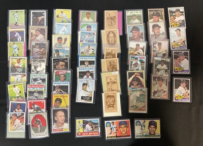 Lot 507 - BASEBALL - A collection of trading cards for...